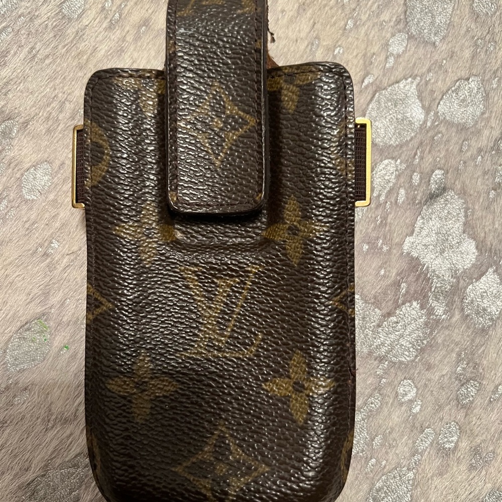 Authentic. Collectible. Original.Louis Vuitton wristlet.